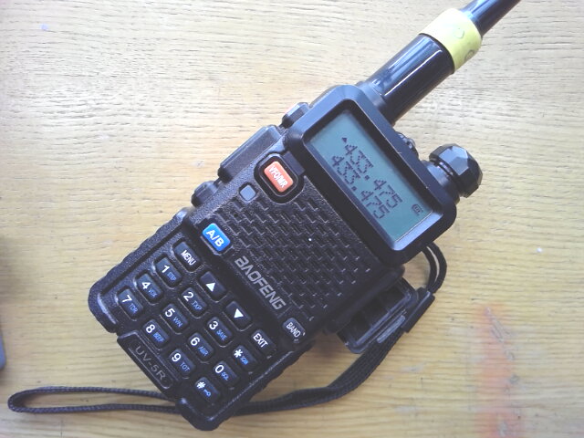 The author's UV-5R, fitted with a genuine Nagoya NA-771 antenna and a wrist strap